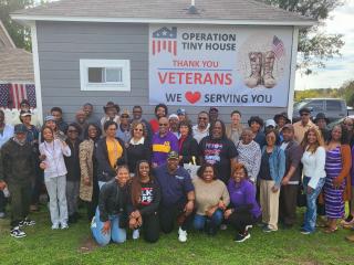 Group photo of attendees at an Accessory Dwelling Unite breakfast seminar.