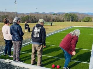 Older adults playing Bocce Ball.