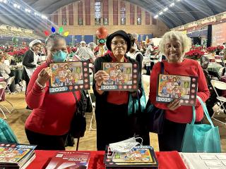 Older adult women holding Emergency Preparedness Calendars.