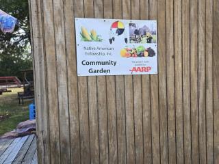 Sign for community garden on shed.