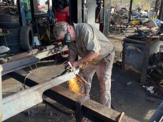 Assembly and welding of artistic sign markers.