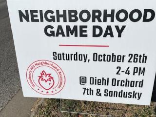 Sign for community game day event.