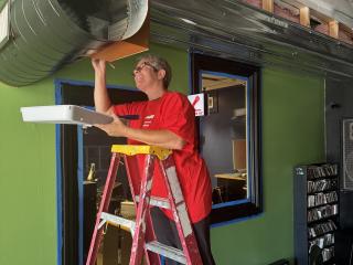 Volunteers painting interior.