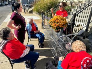 Older adult volunteers preparing for the day's planting.