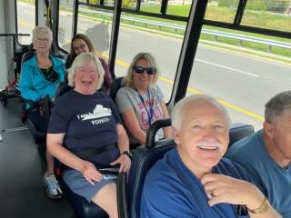 Older adults participating in public transit training on a bus.