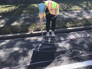 Preparing bike lanes for volunteers and paint.