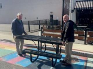 Installing new picnic tables.