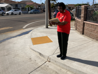 Older adult conducting a Bike Audit at intersection.