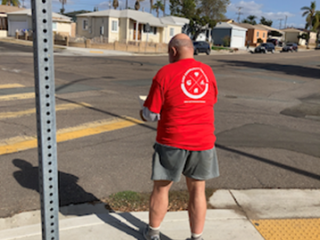 Older adult conducting a Bike Audit at intersection.