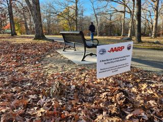 New bench with sign acknowledging AARP.