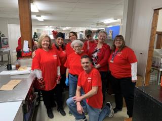 Group photo of staff members at community event.