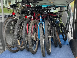 Van of bicycles to distribute.