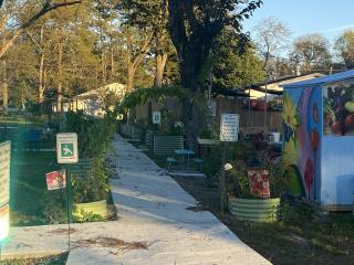 Community garden with fitness station signs.