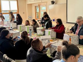 Group learning to make homemade air filters.