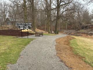 Sign thanking AARP near new benches.