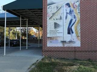 Jazz Age mural on brick wall.