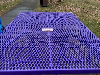 AARP sign on picnic table.