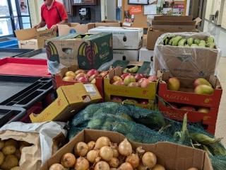 Fresh fruits and vegetables ready for distribution.